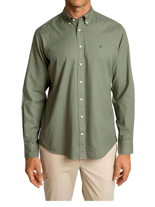 Green button-up shirt worn by a person on a white background