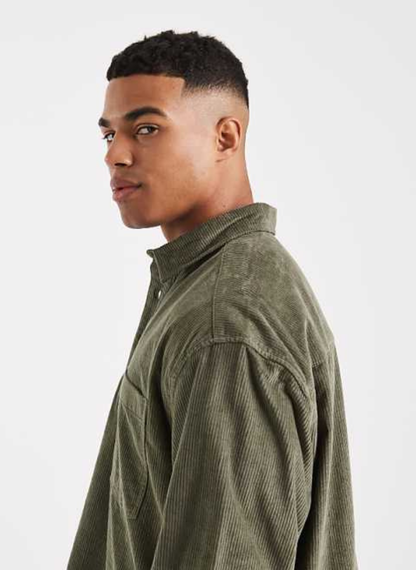 ASOS DESIGN - boxy oversized cord rugby shirt in green