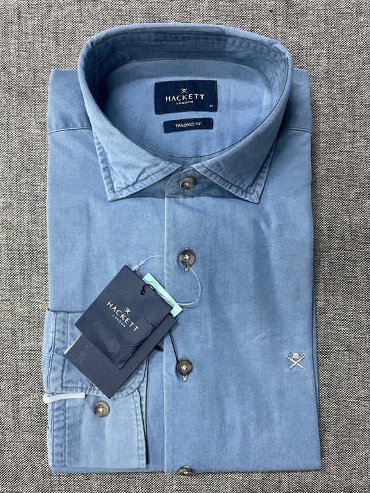 Light blue shirt with Hackett label on a textured gray background