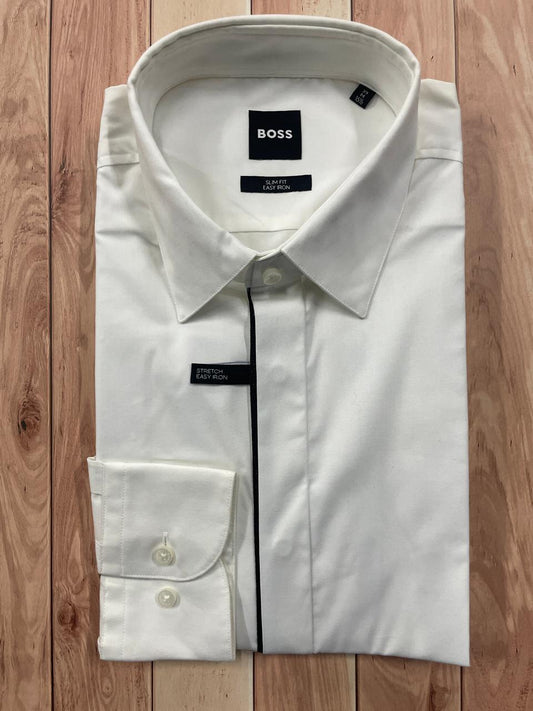 A white BOSS long-sleeve dress shirt with black piping details, neatly folded and displayed on a light brown wooden plank background.